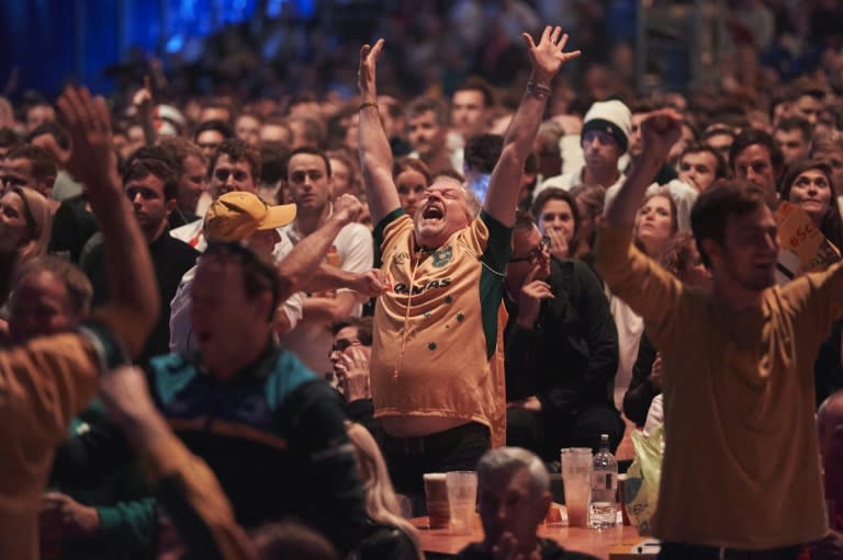 Austalian fans celebrate after Australia scored a try as they watch the action from a fan zone in Richmond, south west London on October 3, 2015