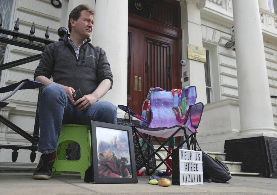 Richard Ratcliffe starts a protest outside the Iranian Embassy in London Saturday June 15, 2019, where he is on hunger strike in solidarity with his wife, Nazanin Zaghari-Ratcliffe, who has informed the Iranian judiciary she had stopped taking food in protest at her "unfair imprisonment" in Evin Prison in Iran. British-Iranian woman Nazanin Zaghari-Ratcliffe, jailed in Tehran for more than three years has begun a hunger strike to protest her detention, her husband said Saturday, who will also fast in support of his wife.(Jonathan Brady/PA via AP)