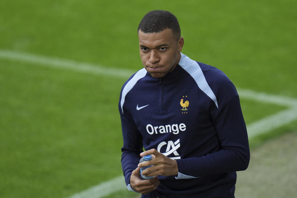 France's Kylian Mbappe gestures during a training session in Paderborn, Germany, Thursday, June 13, 2024. Mbappe was absent when the squad took part in an open practice session at its European Championship base on Thursday. France will play against Austria during their Group D soccer match at the Euro 2024 soccer tournament on June 17. (AP Photo/Hassan Ammar)