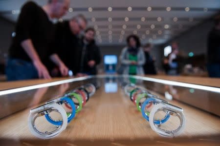 A display with Apple Watch in different colours is seen at an Apple Store in Berlin April 10, 2015. REUTERS/Stefanie Loos