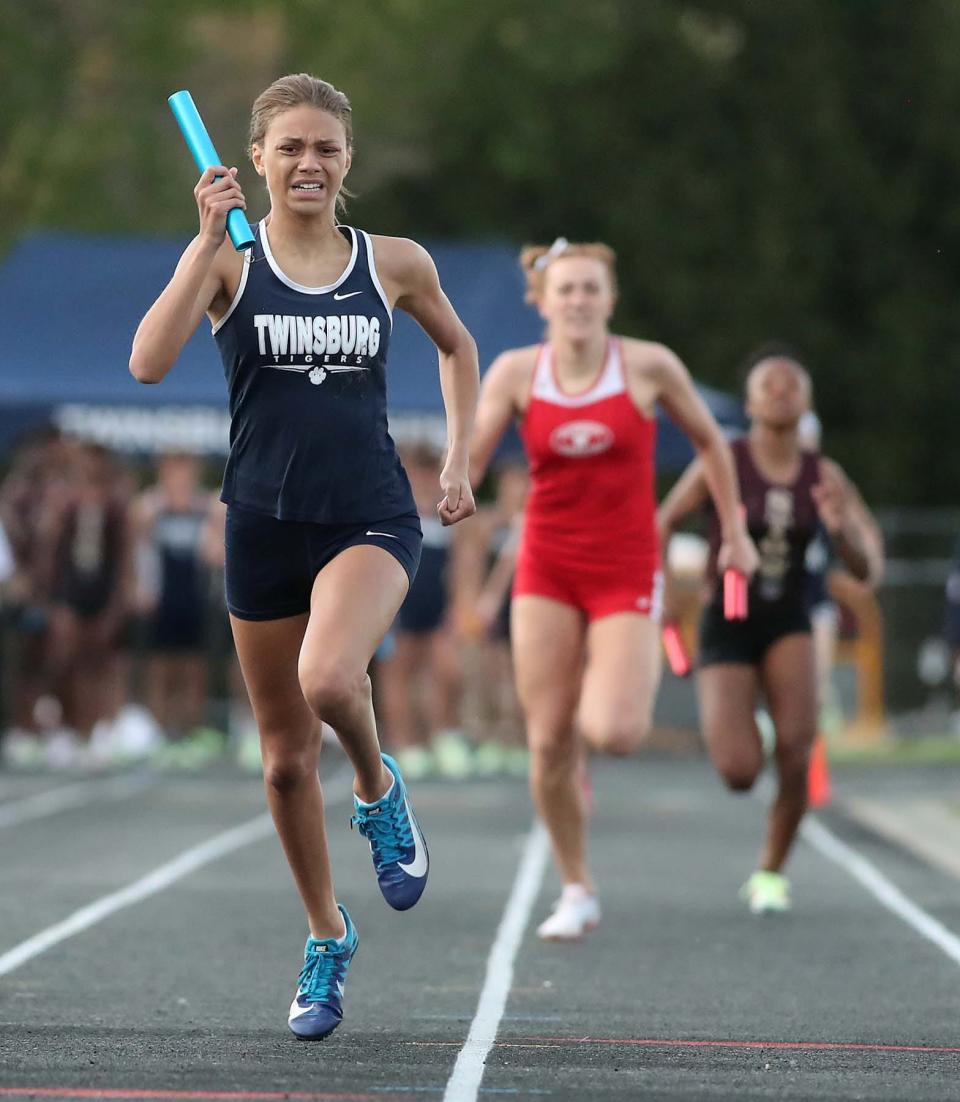 Sophie Besett of Twinsburg, anchors the team of Bree Banach, Sanayah Ruffin and Arriah Gilmer to a first place finish in the 4x400 meter relay with a time of 3:59.60 during the Suburban League National Conference track meet in Twinsburg on Thursday. 