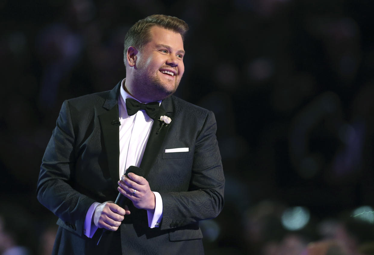 FILE - In this Jan. 28, 2018 file photo, James Corden hosts at the 60th annual Grammy Awards at Madison Square Garden in New York. Corden brings a gleeful buoyancy to his CBS late-night show. That’s the case whether he's bantering with all his guests at once or singing duets with stars as he drives.  (Photo by Matt Sayles/Invision/AP)