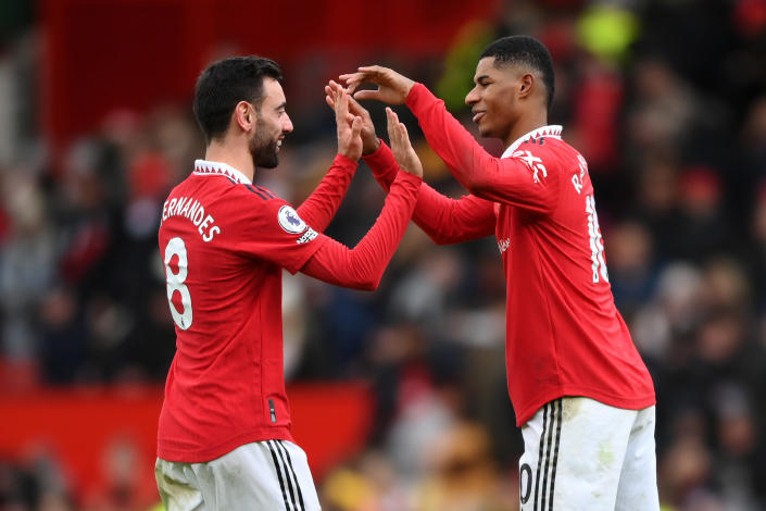 Manchester United&#39;s Bruno Fernandes (left) and Marcus Rashford celebrate their side&#39;s victory in the Premier League against Manchester City.