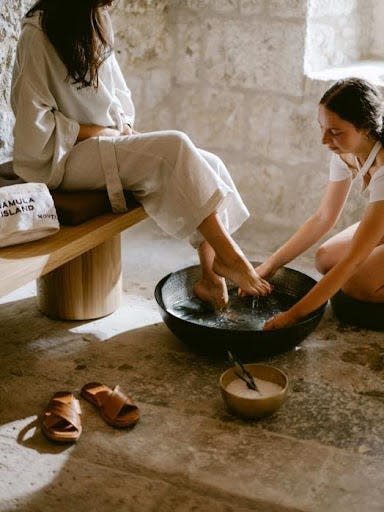 A woman has her feet cleaned at the Mamula Island hotel.