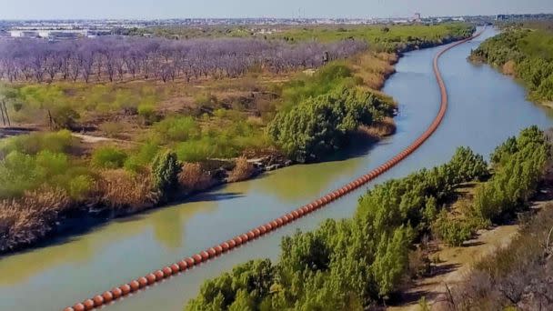 PHOTO: An illustration of a floating barrier in the Rio Grande River of Texas displayed by Texas Republican Governor Abbott as he signed several bills on June 8, 2023, to strengthen Texas border security. (Zuma Press/Alamy Live News via AP)