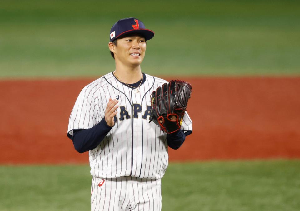 Team Japan pitcher Yoshinobu Yamamoto (17) reacts against Korea in a baseball semifinal match during the Tokyo 2020 Olympic Summer Games at Yokohama Baseball Stadium.