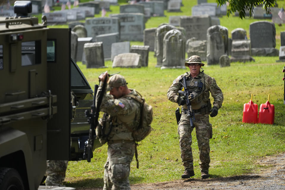 Law enforcement gather as they search for escaped convict Danelo Cavalcante in Glenmoore, Pa., Monday, Sept. 11, 2023. (AP Photo/Matt Rourke)