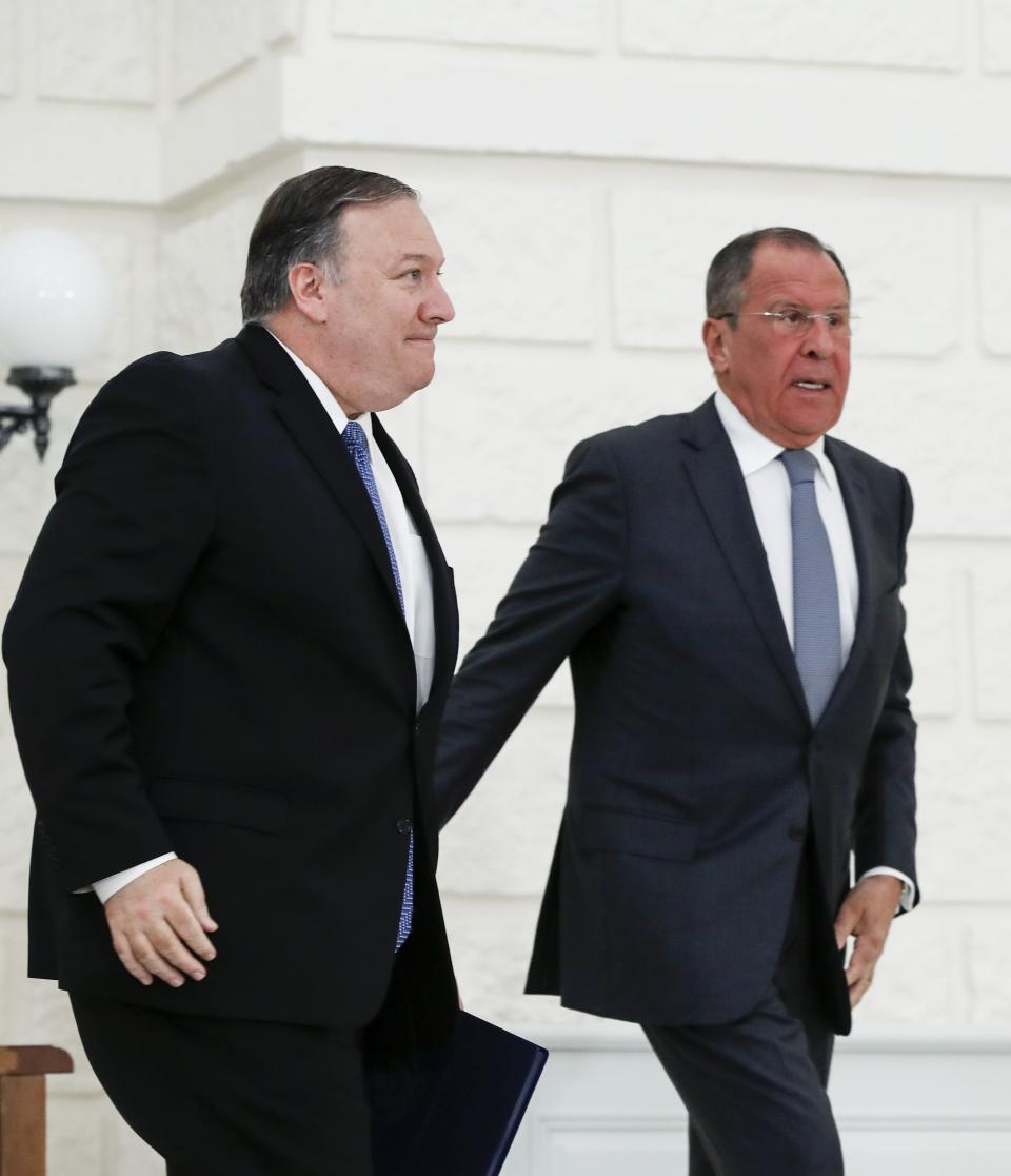 U.S. Secretary of State Mike Pompeo, left, and Russian Foreign Minister Sergey Lavrov leave their joint news conference following the talks in the Black Sea resort city of Sochi, southern Russia, Tuesday, May 14, 2019. Pompeo's first trip to Russia starts Tuesday in Sochi, where he and Russian Foreign Minister Sergey Lavrov are sitting down for talks and then having a joint meeting with President Vladimir Putin. (AP Photo/Pavel Golovkin, Pool)