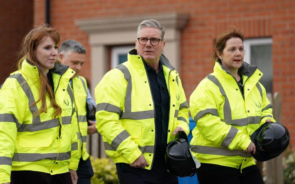 Labour leader Sir Keir Starmer with deputy leader Angela Rayner (left) and Claire Ward (right), now Mayor of the East Midlands,  during a visit to a housing development in Derby, April 19