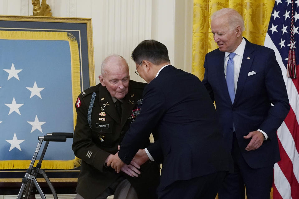 President Joe Biden looks on as retired U.S. Army Col. Ralph Puckett is greeted by South Korean President Moon Jae-in, during a Medal of Honor ceremony in the East Room of the White House, Friday, May 21, 2021, in Washington. (AP Photo/Alex Brandon)
