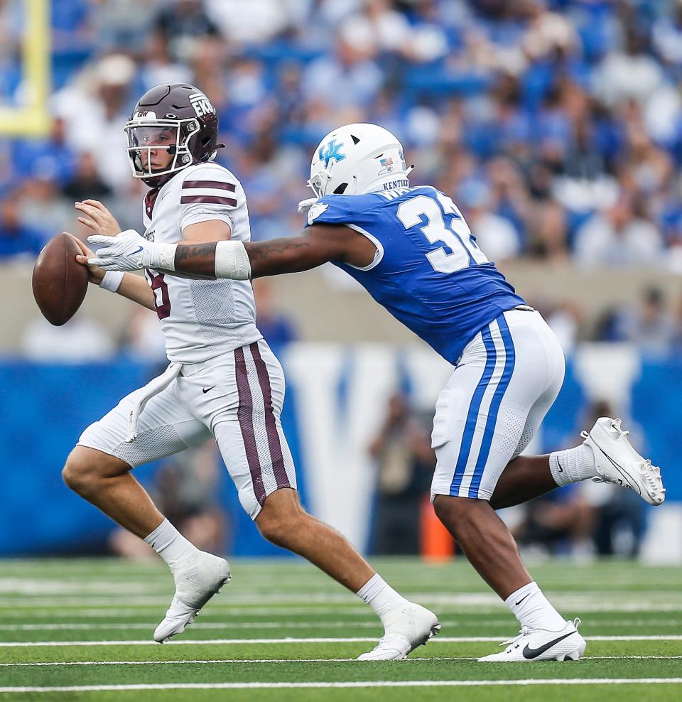 Kentucky Wildcats linebacker Trevin Wallace (32) pressures Eastern Kentucky Colonels quarterback Parker McKinney (18) in the second quarter as the Wildcats won 28-17. Sept. 9, 2023. 