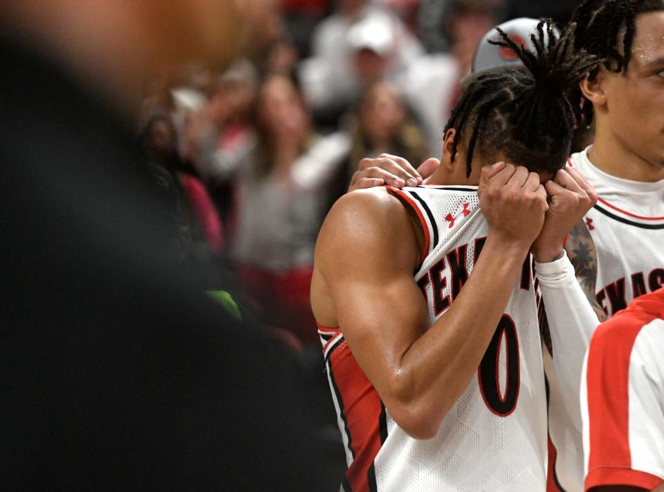 Texas Tech's guard Chance McMillian (0) becomes emotional after the team's loss to Cincinnati Saturday. UC ended an 11-game home win streak by the Red Raiders.