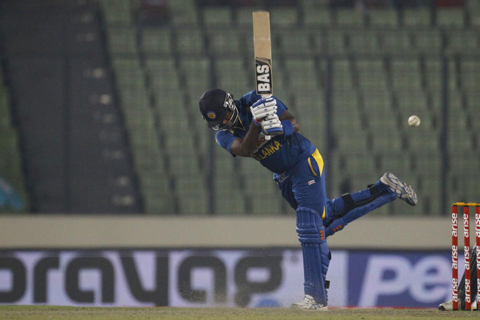 Sri Lanka’s Angelo Mathews plays a shot during the Asia Cup one-day international cricket tournament match against Bangladesh in Dhaka, Bangladesh, Thursday, March 6, 2014. (AP Photo/A.M. Ahad)