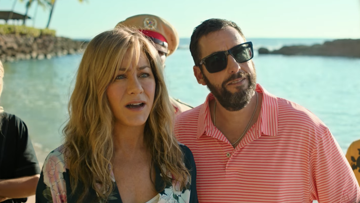  Aniston and Sandler on a beach in Murder Mystery 2 