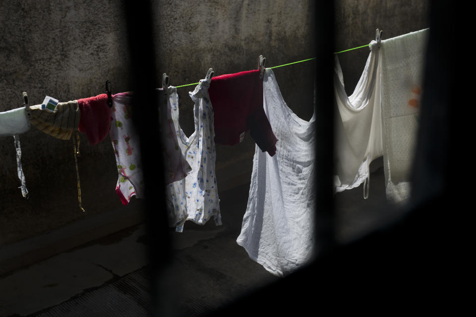 This Tuesday, Aug. 14, 2018 photo shows laundry hanging to dry outside a room used as a maternity ward at the Masaidiano Health Center in Lubumbashi, Democratic Republic of the Congo. An Associated Press investigation found that of more than 20 hospitals and clinics visited in Lubumbashi, all but one detain patients who cannot pay their bills. While some hospitals detain patients for weeks or months before giving up, the AP found one patient trapped for more than a year and obtained documentation on another person held for about two years. (AP Photo/Jerome Delay)