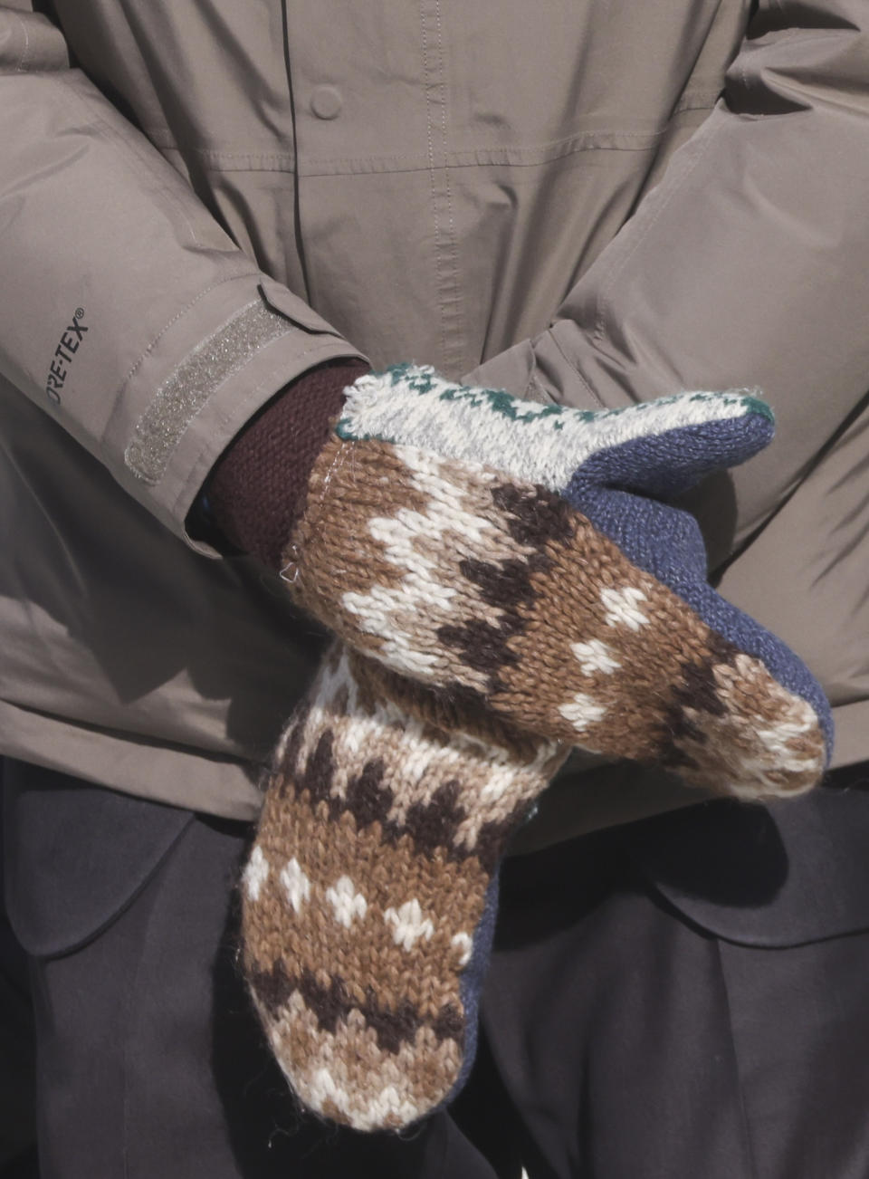 FILE - In this Jan. 20, 2021 file photo, Sen. Bernie Sanders, I-Vt., wears mittens as he attends President Joe Biden's inauguration ceremony at the U.S. Capitol in Washington. Sanders says the wooly mittens he wore to the ceremony that sparked endless quirky memes across social media have helped to raise $1.8 million in the last five days for charitable organizations in his home state of Vermont through the sale of T-shirts, sweatshirts and stickers with the iconic image of him sitting with his arms and legs crossed in his brown parka and recycled wool mittens. (Jonathan Ernst/Pool Photo via AP)