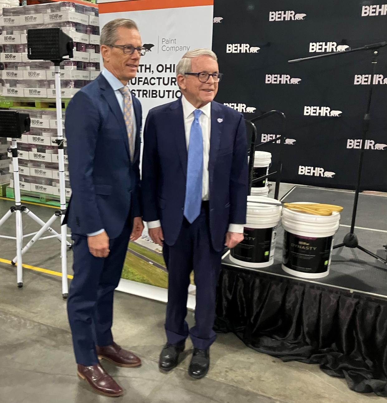 Ohio Gov. Mike DeWine, left, with Keith Allman, CEO of Masco Corp., the parent company of Behr Paint Co., on Tuesday in Heath.