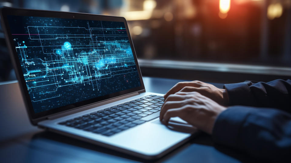 A programmer typing on a laptop, highlighting the cutting edge software engineering solutions provided by the company.