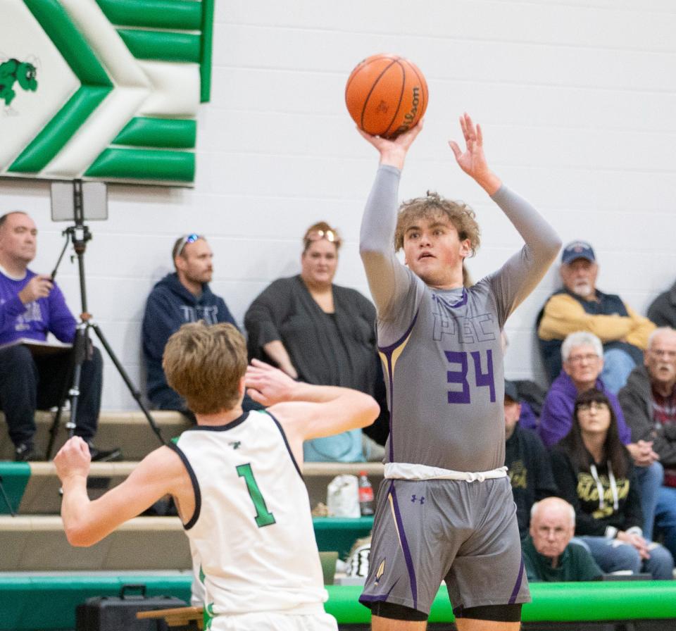 Pecatonica's Korbin Gann shoots a three pointer against Scales Mound on Thursday, Dec. 8, 2022, at Scales Mound High School in Scales Mound. Pecatonica was recently ranked No. 2 in the state's recent AP poll for the first time ever.