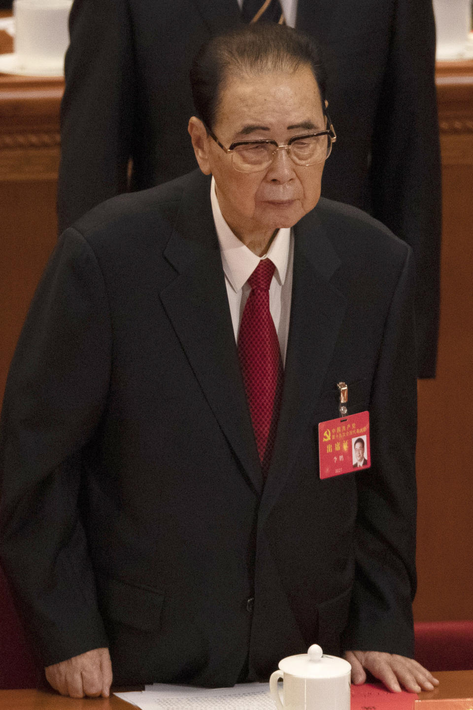 CORRECTS AGE TO 90, INSTEAD OF 91 - In this Oct. 24, 2017, photo, former Chinese Premier Li Peng, stands during the closing session of China's 19th Party Congress at the Great Hall of the People in Beijing, China. Li Peng, a former hard-line Chinese premier best known for announcing martial law during the 1989 Tiananmen Square pro-democracy protests, has died on Monday July 22, 2019 of unspecified illness. He was 90. (AP Photo/Ng Han Guan)