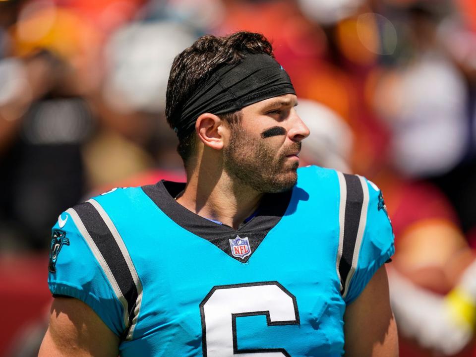 Baker Mayfield waits for the start of a preseason game against the Washington Commanders.