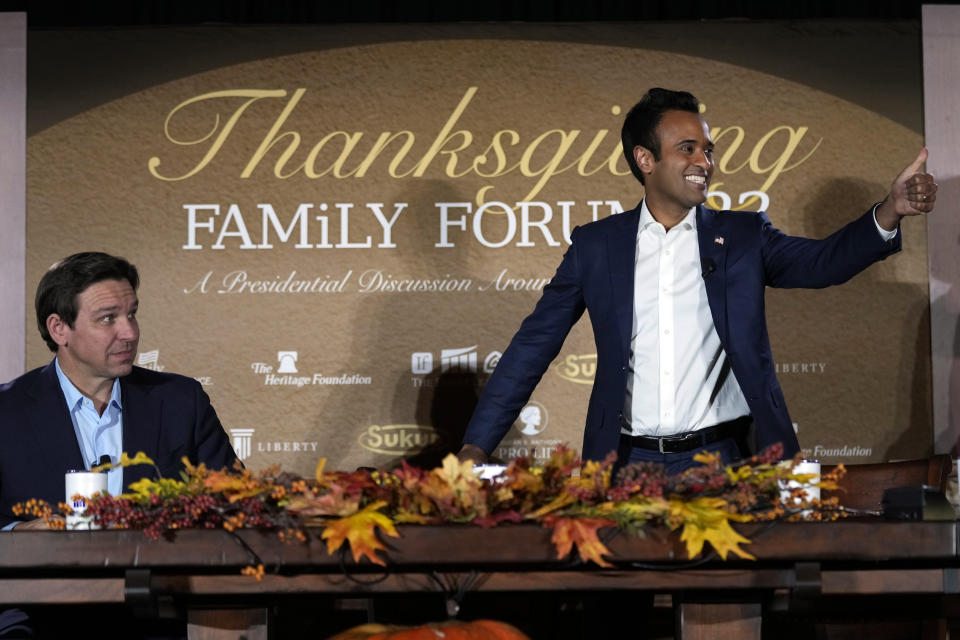 Republican presidential candidate businessman Vivek Ramaswamy arrives at the Family Leader's Thanksgiving Family Forum as Republican presidential candidate Florida Gov. Ron DeSantis, left, WATCHES, Friday, Nov. 17, 2023, in Des Moines, Iowa. (AP Photo/Charlie Neibergall)