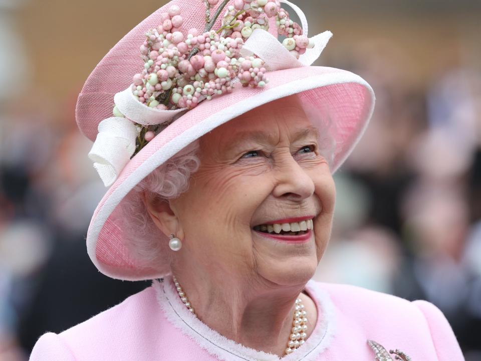 Queen Elizabeth II smiling profit shot, shoulders up