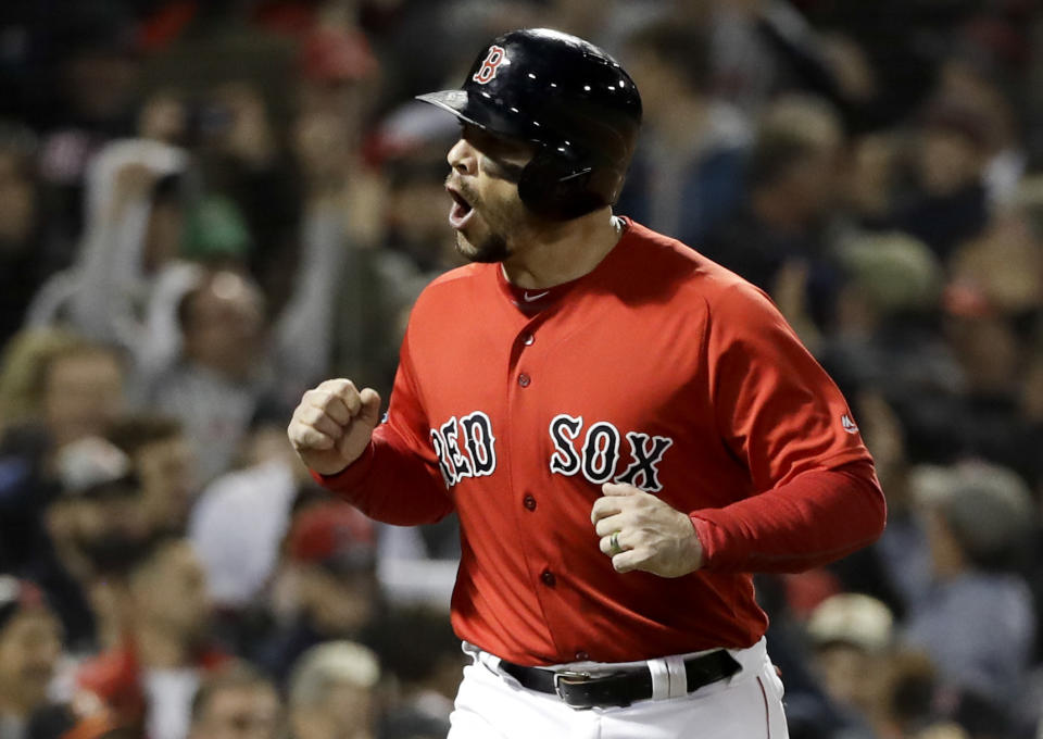 Boston Red Sox's Steve Pearce celebrates after being walked in for a run during the fifth inning in Game 1 of a baseball American League Championship Series against the Houston Astros on Saturday, Oct. 13, 2018, in Boston. (AP Photo/David J. Phillip)