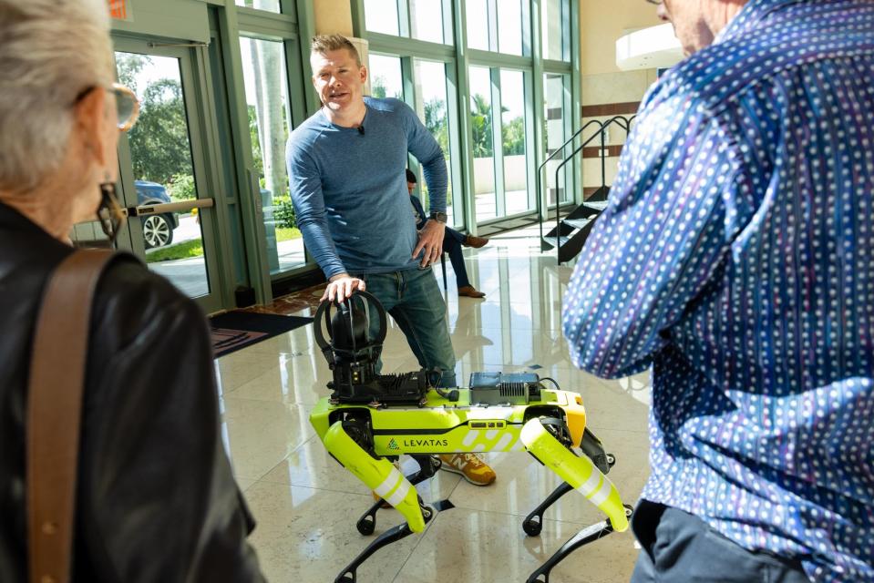 Chris Nielsen, founder and CEO of Palm Beach County-based Levatas, introduces Boston Dynamics' Spot robot to attendees of the first Corporate Partners Business Speaker Series installment of the season at the Kravis Center for the Performing Arts on Monday, Nov. 6.