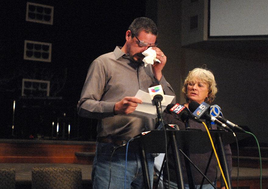 Krystle Dikes' father Shaun Dikes wipes tears from his eyes as he and his wife Charlotte address the media during a press conference at the First Baptist Church in Bristol, Ind. Saturday, Jan. 18, 2014. Shawn Walter Bair of Elkhart shot and killed Krystle Dikes Wednesday night at a Martin's Super Market in Elkhart. He also killed 44-year-old shopper Rachelle Godfread before being fatally shot by police. (AP Photo/The Elkhart Truth, Jennifer Shephard)