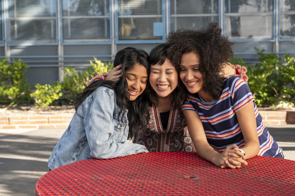 This handout photo provided by Netflix shows Maitreyi Ramakrishnan as Devi Vishwakumar, from left, Ramona Young as Eleanor Wong and Lee Rodriguez as Fabiola Torres in a scene from "Never Have I Ever." (Lara Solanki/Netflix via AP)