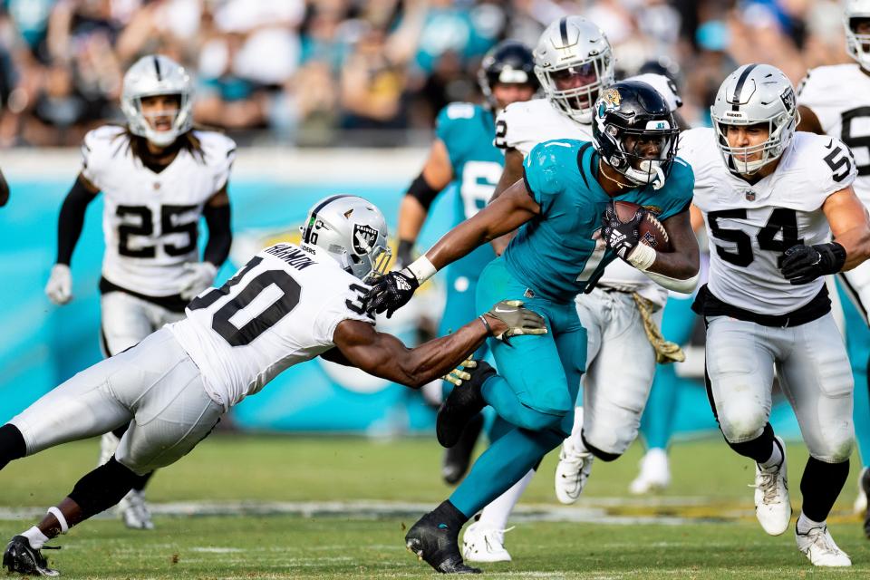 Travis Etienne Jr. rushed for 109 yards and two touchdowns in the Jaguars' 27-20 win over the Raiders.