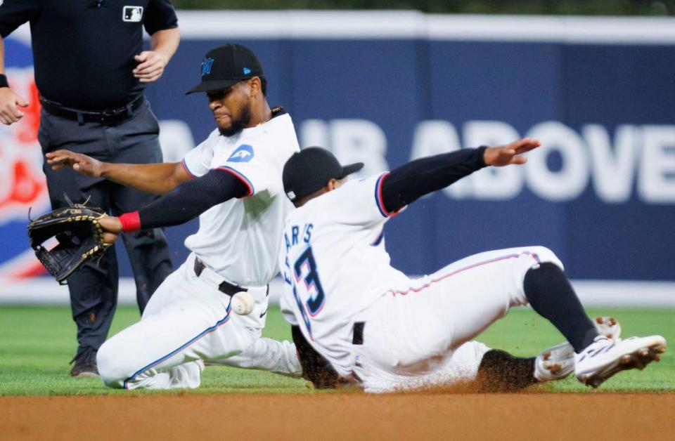 Miami Marlins shortstop Xavier Edwards (63) and Miami Marlins second baseman Otto Lopez (61) collide and miss the ball during the first inning of a baseball game on Monday, Aug. 5, 2024, at loanDepot Park in Miami.