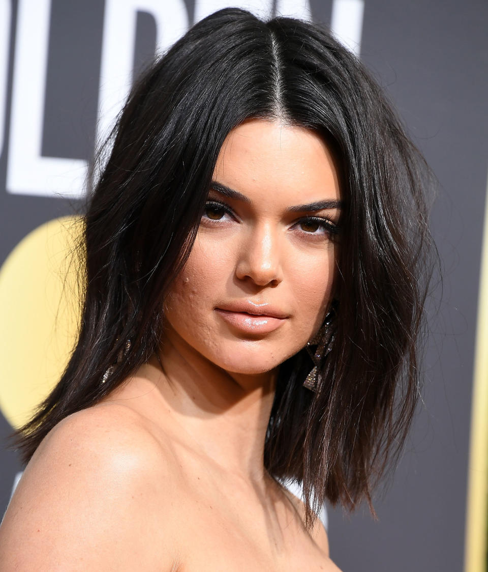 Model Kendall Jenner, pictured at the Golden Globes with some blemishes, just got more beautiful in the eyes of some fans for encouraging them to not let acne in the way. (Photo: Steve Granitz via Getty Images)