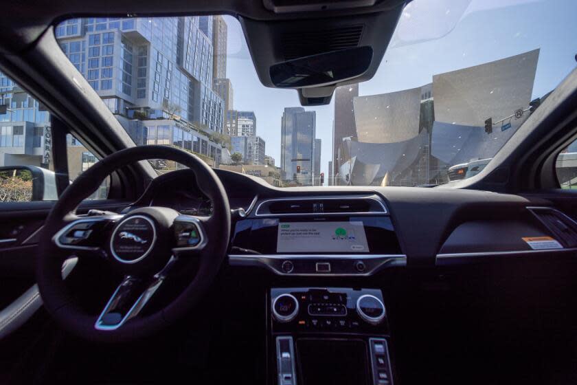 Los Angeles, CA - March 11: (EDS NOTE-NEWS EMBARGO UNTIL WEDNESDAY) A Waymo robotaxi Jaguar I-PACEs driverless car drives around downtown Los Angeles Monday, March 11, 2024. Waymo is about to announce the release of their robotaxi fleet across Los Angeles. The new service will allow users to go from downtown to Santa Monica, covering hundreds of miles. The service is expected to start this week but won't be available for all for a few more weeks. Waymo One fleet consists of fully electric Jaguar I-PACEs - the world's first premium electric autonomously driven vehicle. The Waymo Driver uses fully autonomous technology that is always in control of the vehicle from pickup to destination. (Allen J. Schaben / Los Angeles Times)