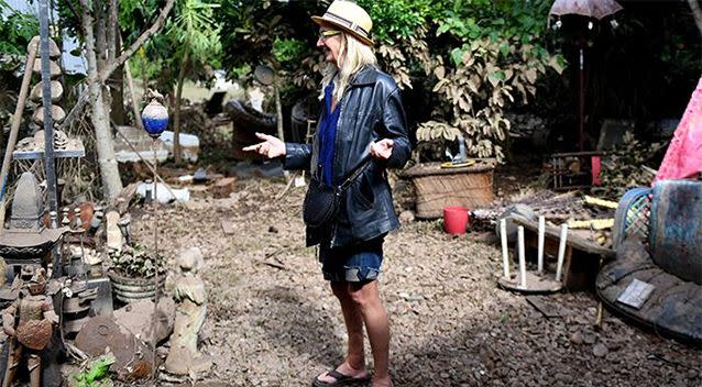 Christine Devine assesses the damage at her Lismore home. Photo: AAP