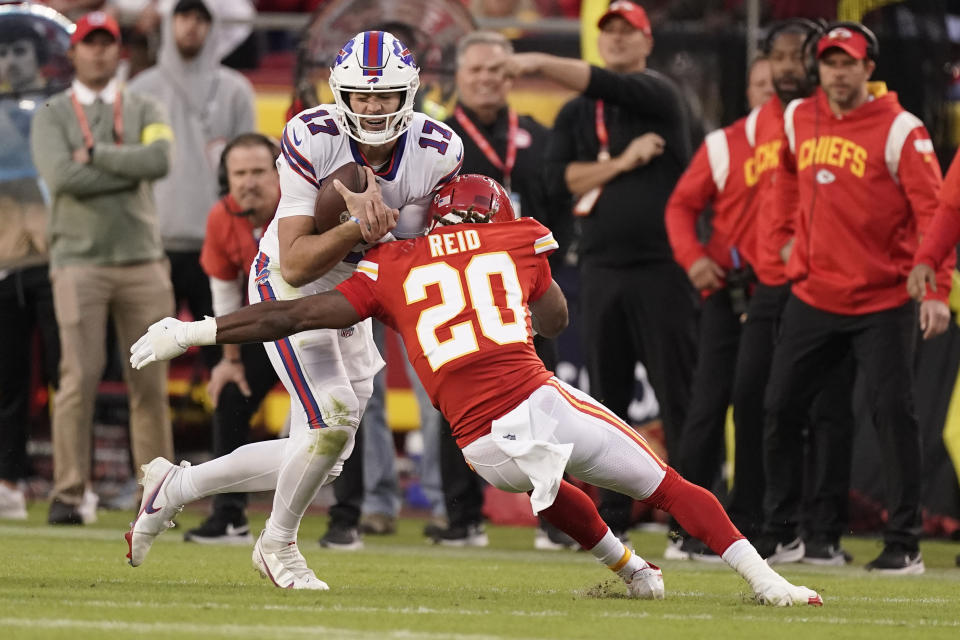 Buffalo Bills quarterback Josh Allen (17) is stopped by Kansas City Chiefs safety Justin Reid (20) during the second half of an NFL football game Sunday, Oct. 16, 2022, in Kansas City, Mo. (AP Photo/Charlie Riedel)