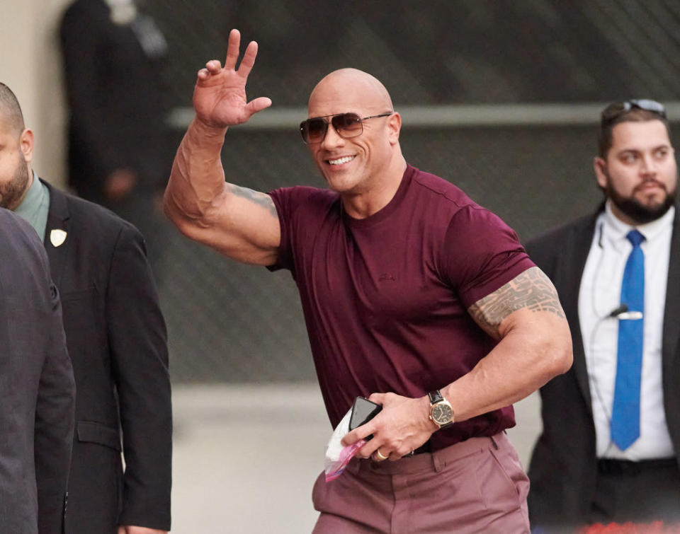 Dwayne Johnson is seen waving to people outside the '"Jimmy Kimmel Live" studios