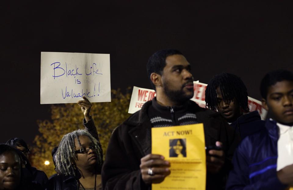 Demonstrators protest the killing of 19-year-old Renisha McBride outside the Dearborn Heights Police Station