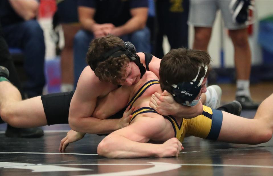 Edgemont's Sander Miller wrestles Shorham-Wading River's Joe Steimel in a 145-lb match at the 39th Annual Edgemont Wrestling Invitational at Edgemont High School in Scarsdale on Saturday, January 8, 2022.