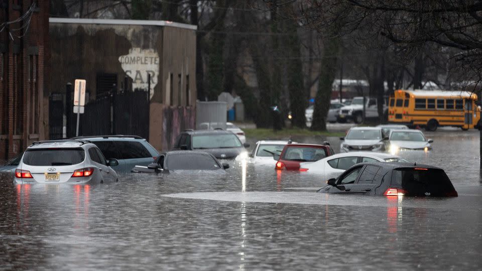 Cars were left stranded in floodwaters on River St in Paterson, New Jersey, on Monday Dec. 18, 2023. - Tariq Zehawi/NorthJersey.com/USA TODAY NETWORK