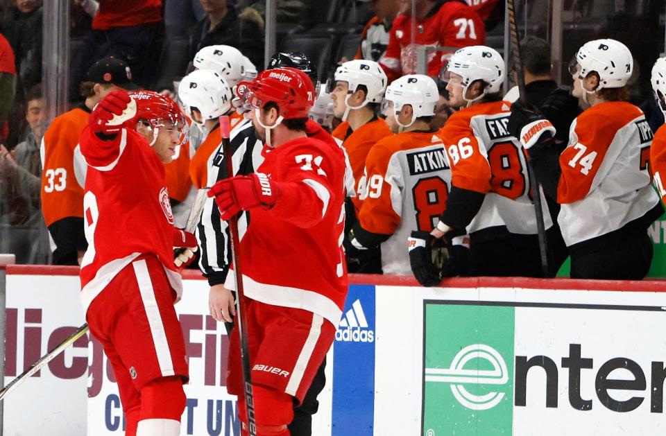 Detroit Red Wings right wing Patrick Kane (88) celebrates with center Dylan Larkin (71) after scoring in the shootout against the Philadelphia Flyers at Little Caesars Arena in Detroit on Friday, Dec. 22, 2023.