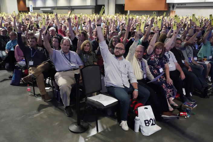 People vote on a motion during the annual Southern Baptist Convention meeting Tuesday, June 15, 2021, in Nashville, Tenn. (AP Photo/Mark Humphrey)