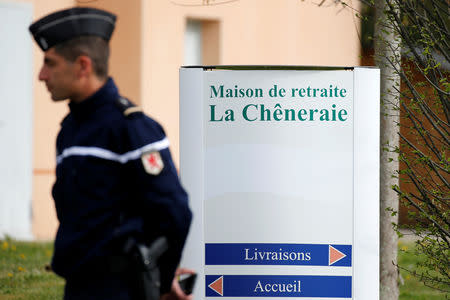 A French gendarme stands at the entrance of the "La Cheneraie" EHPAD (Housing Establishment for Elderly Dependant People) care home following the deaths of five people as a result of suspected food poisoning in Lherm, southern France, April 1, 2019. REUTERS/Regis Duvignau