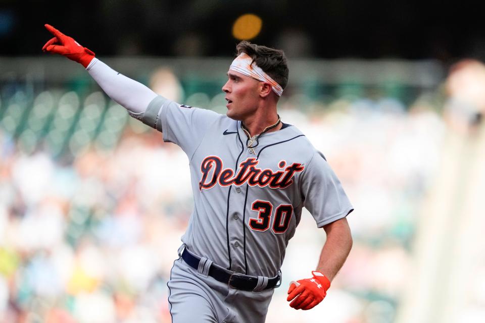 Detroit Tigers'  Kerry Carpenter points after hitting a home run against the Seattle Mariners during the second inning at T-Mobile Park in Seattle on Saturday, July 15, 2023.