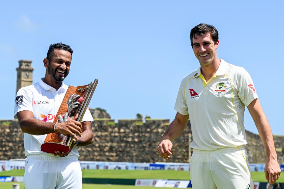 Sri Lanka's captain Dimuth Karunaratne (pictured left) and Australia's captain Pat Cummins (pictured right) share a laugh.