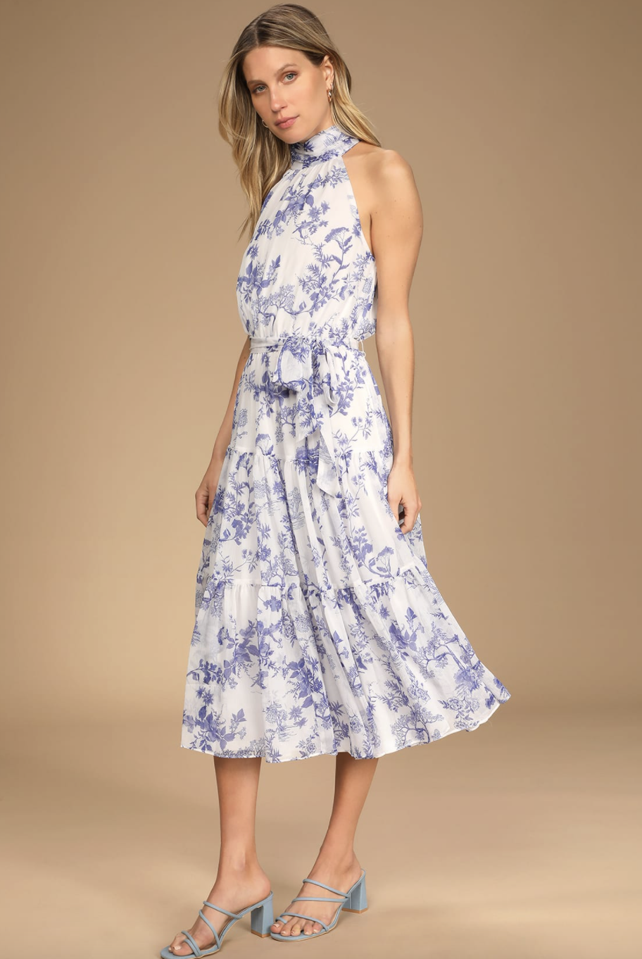 blonde model in blue and white Float to You Halter Tiered Midi Dress (Photo via Lulus)