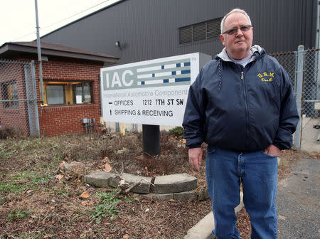 Unemployed autoworker Donald Coy, who was laid off from Ross's auto-parts plant, when it closed its doors in December 2016, is pictured in front of the former manufacturing plant in Canton, Ohio, U.S., January 14, 2017. REUTERS/Aaron Josefczyk