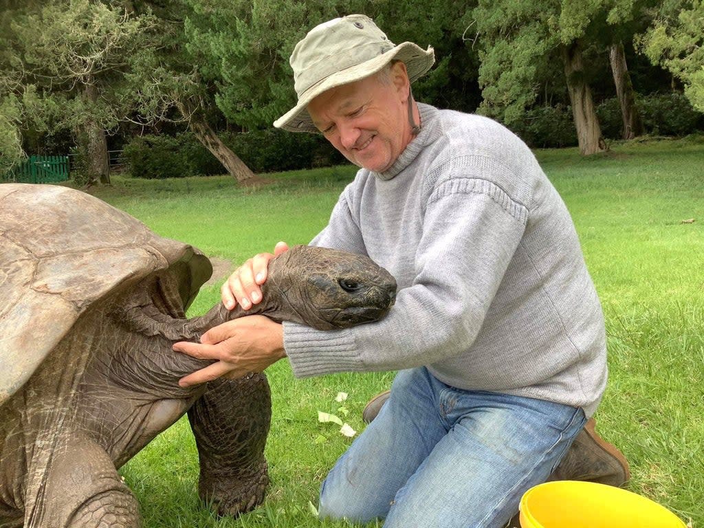 Jonathan the tortoise, 190, and his caretaker, Joe Hollins, 64, on St Helena island (Tina Lucy)