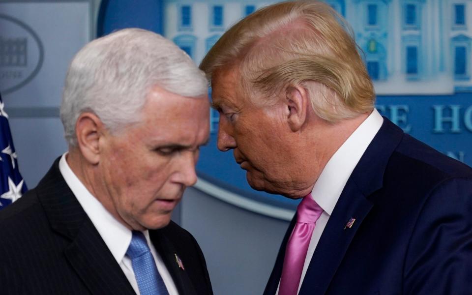 President Donald Trump moves to let Vice President Mike Pence speak during a news conference  - AP